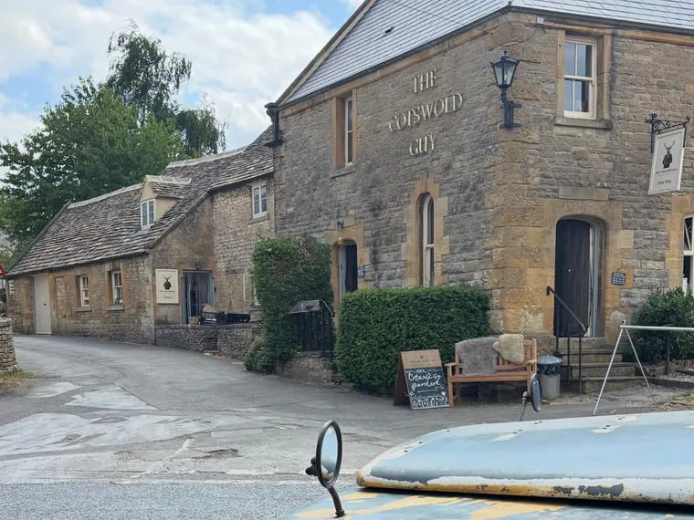 The Cotswold Guy farm shop in Guiting Power, with the Land Rover parked across the lane