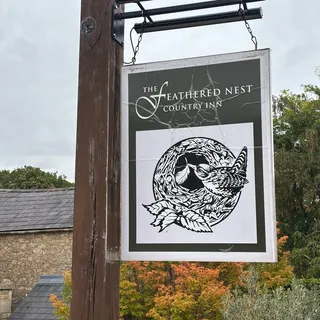 The Feathered Nest pub sign at Nether Westcote